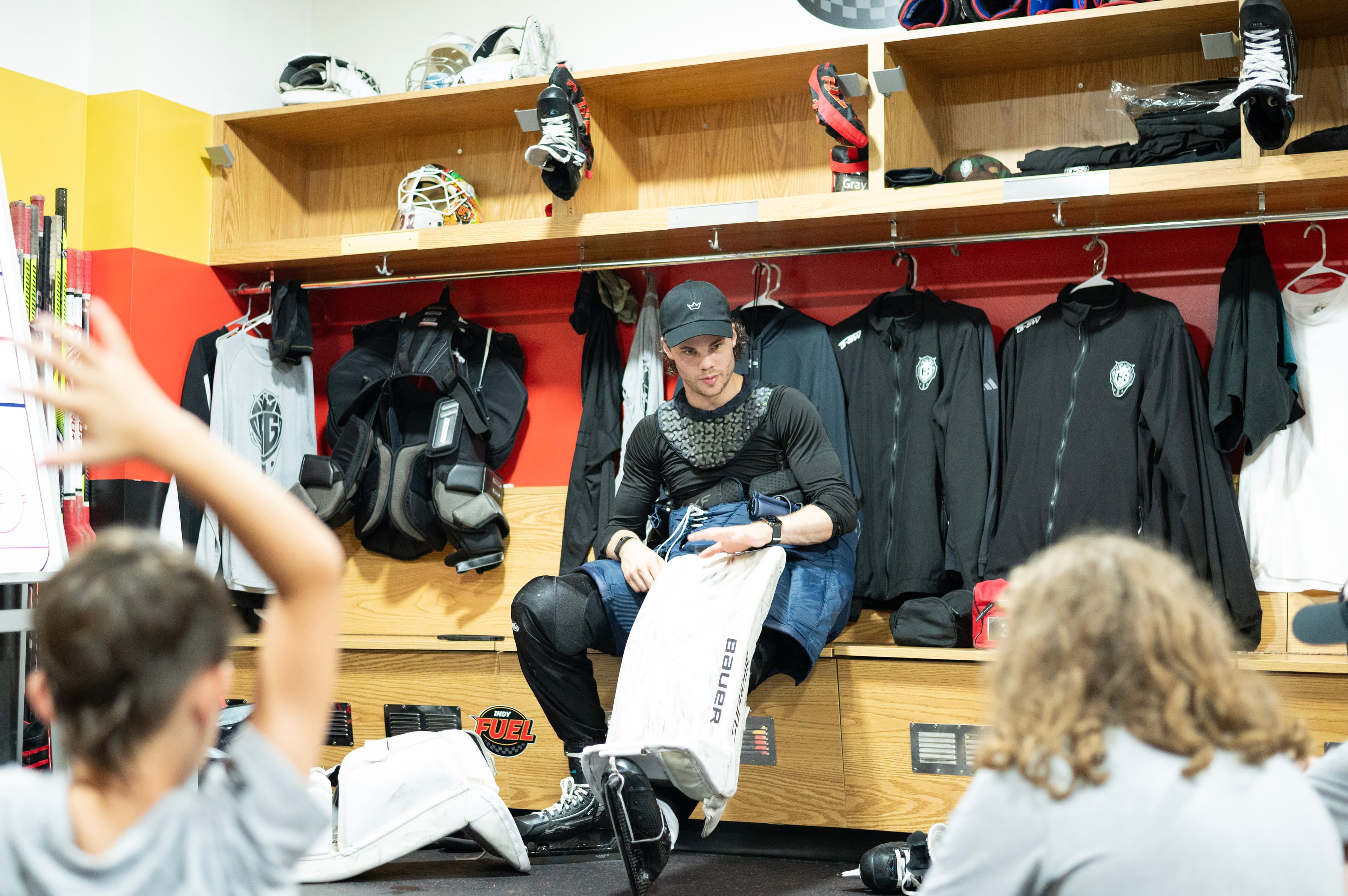 Cam Gray in the locker room with goalies