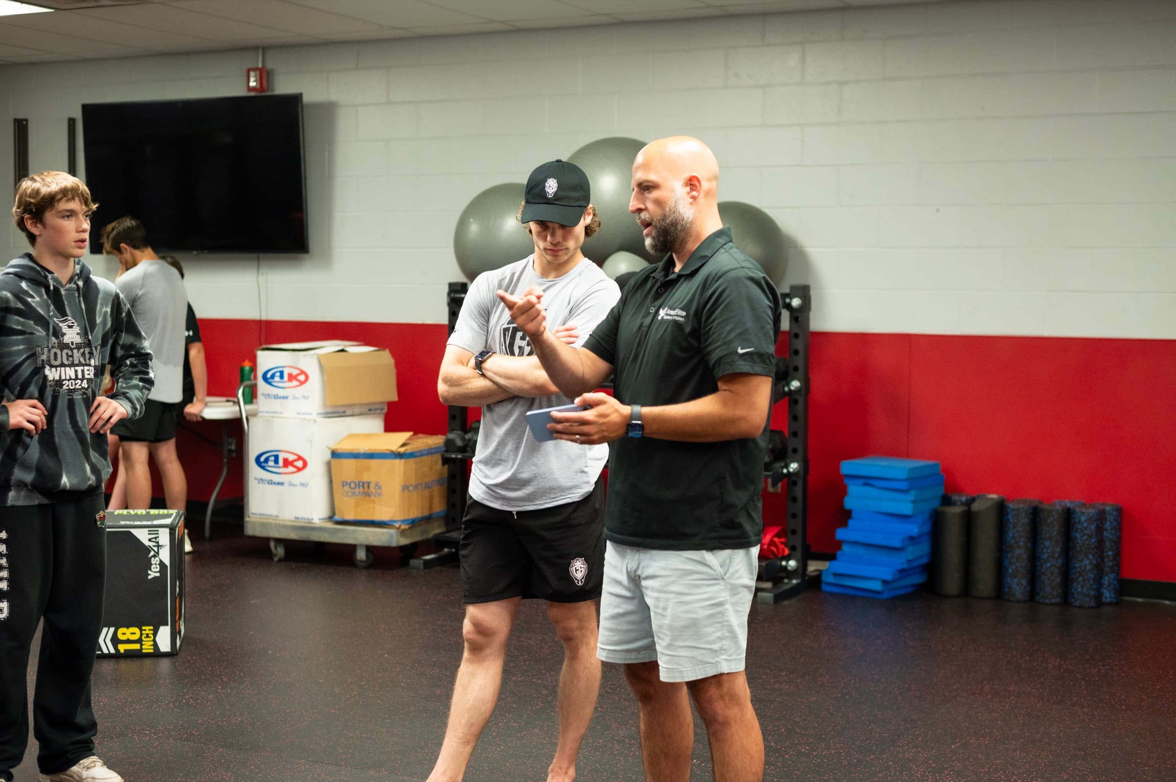 Coaching a goalie through a reaction drill in the CGG × AESV partnership