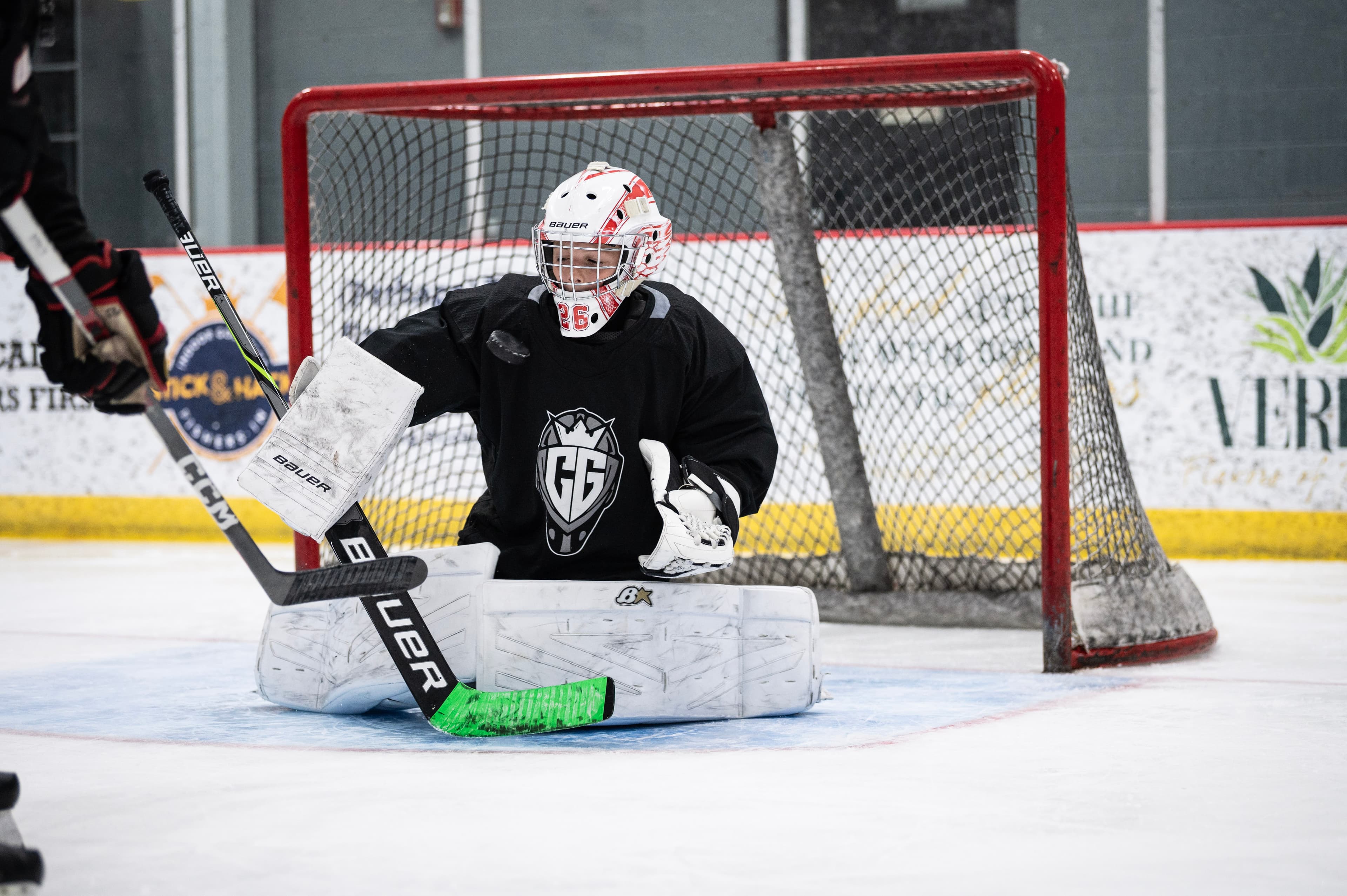 A CGG goalie set at the post during a camp ice session.
