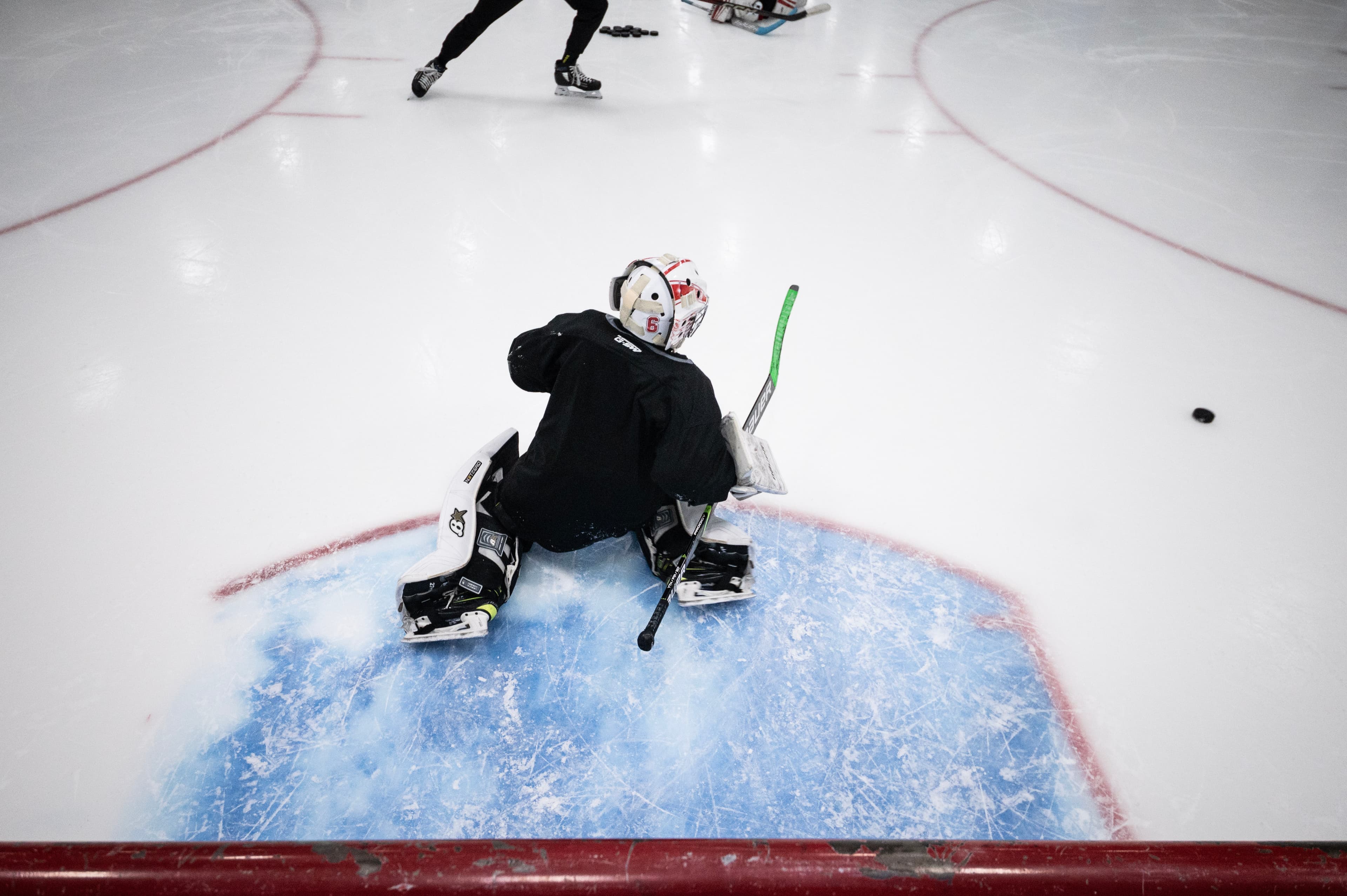 A CGG goalie down in the blue paint, seen from above.