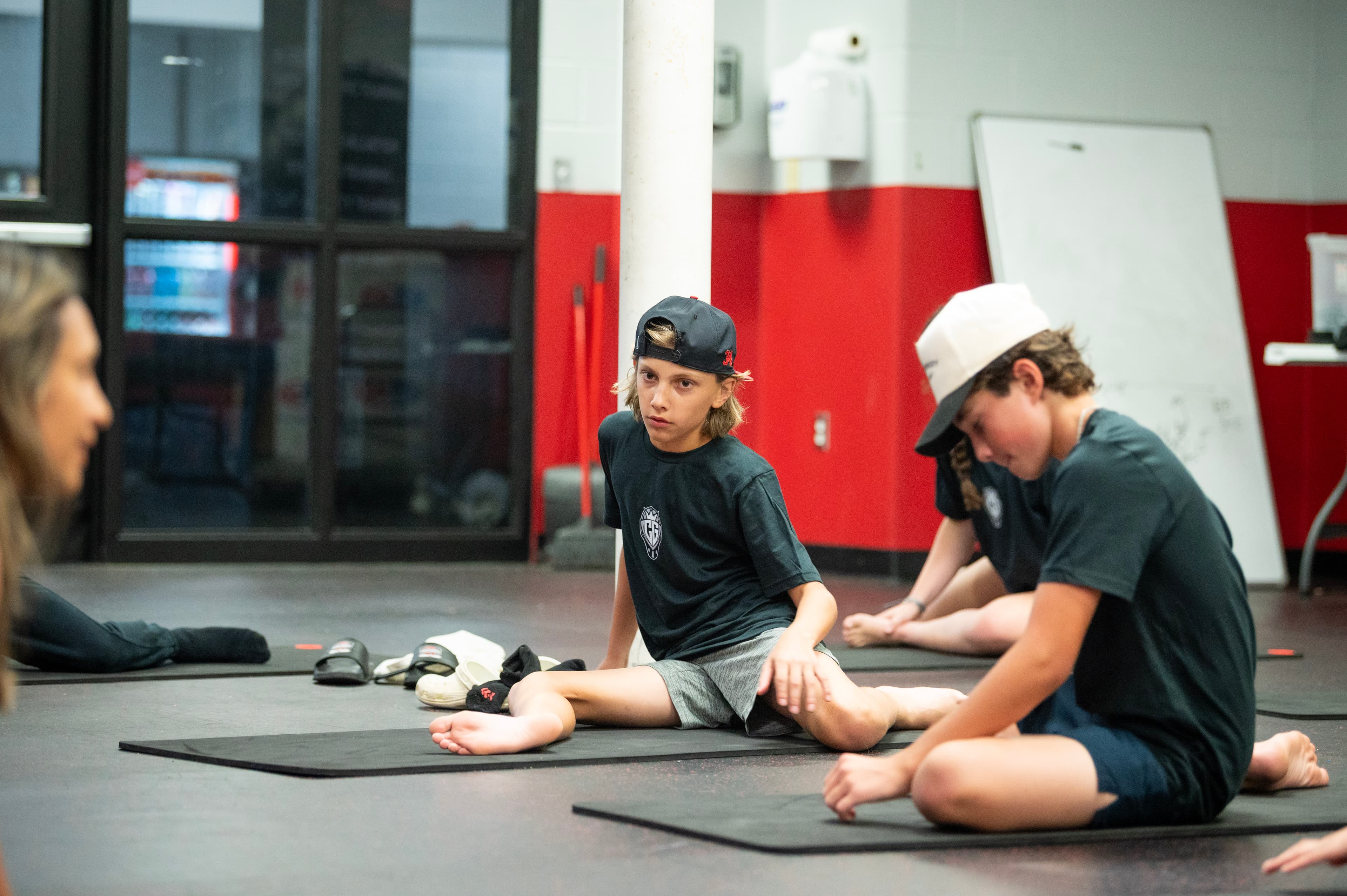 Goalies working through floor mobility in the CGG training room.