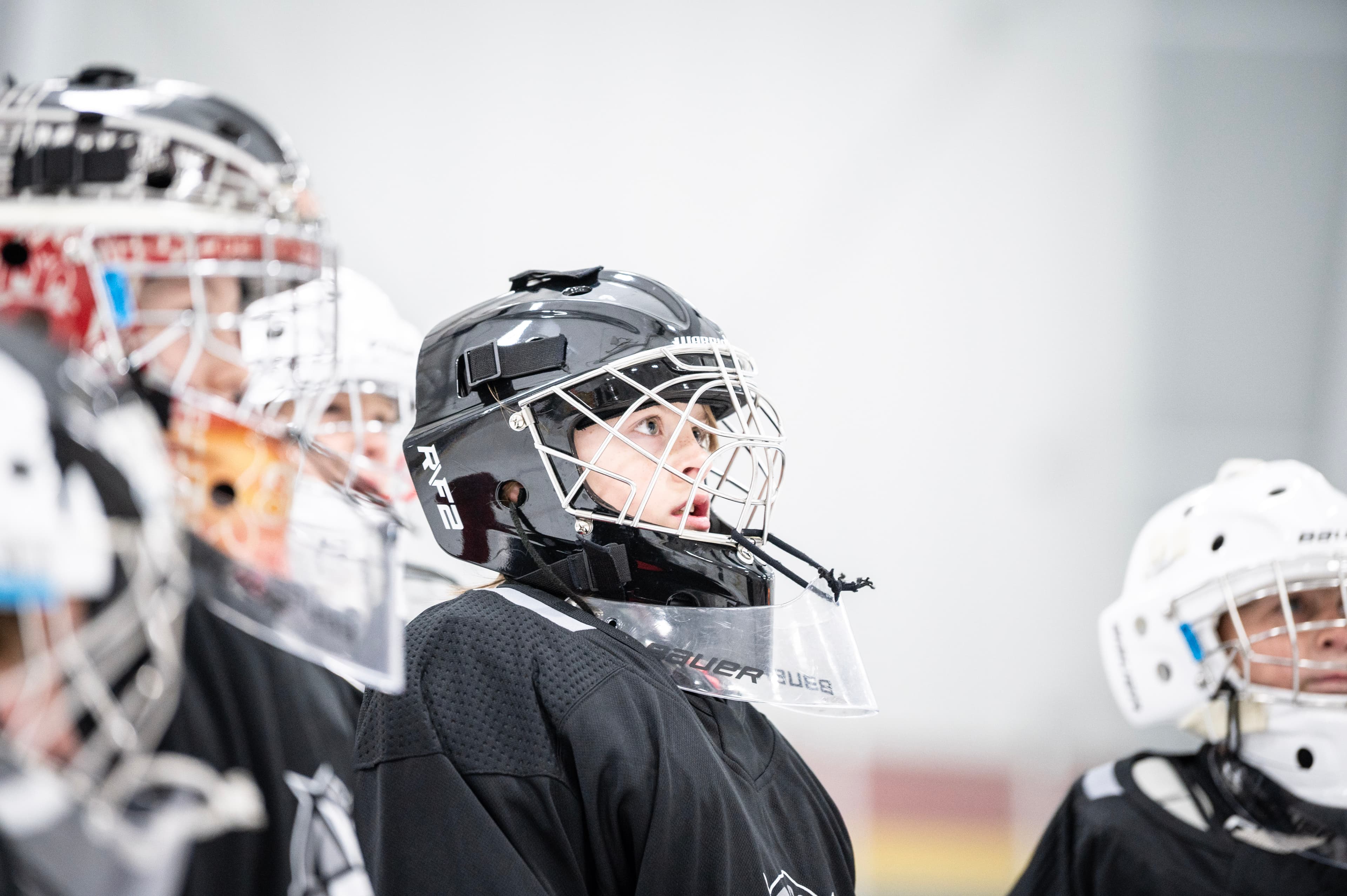 A CGG goalie locked in, eyes up the ice.