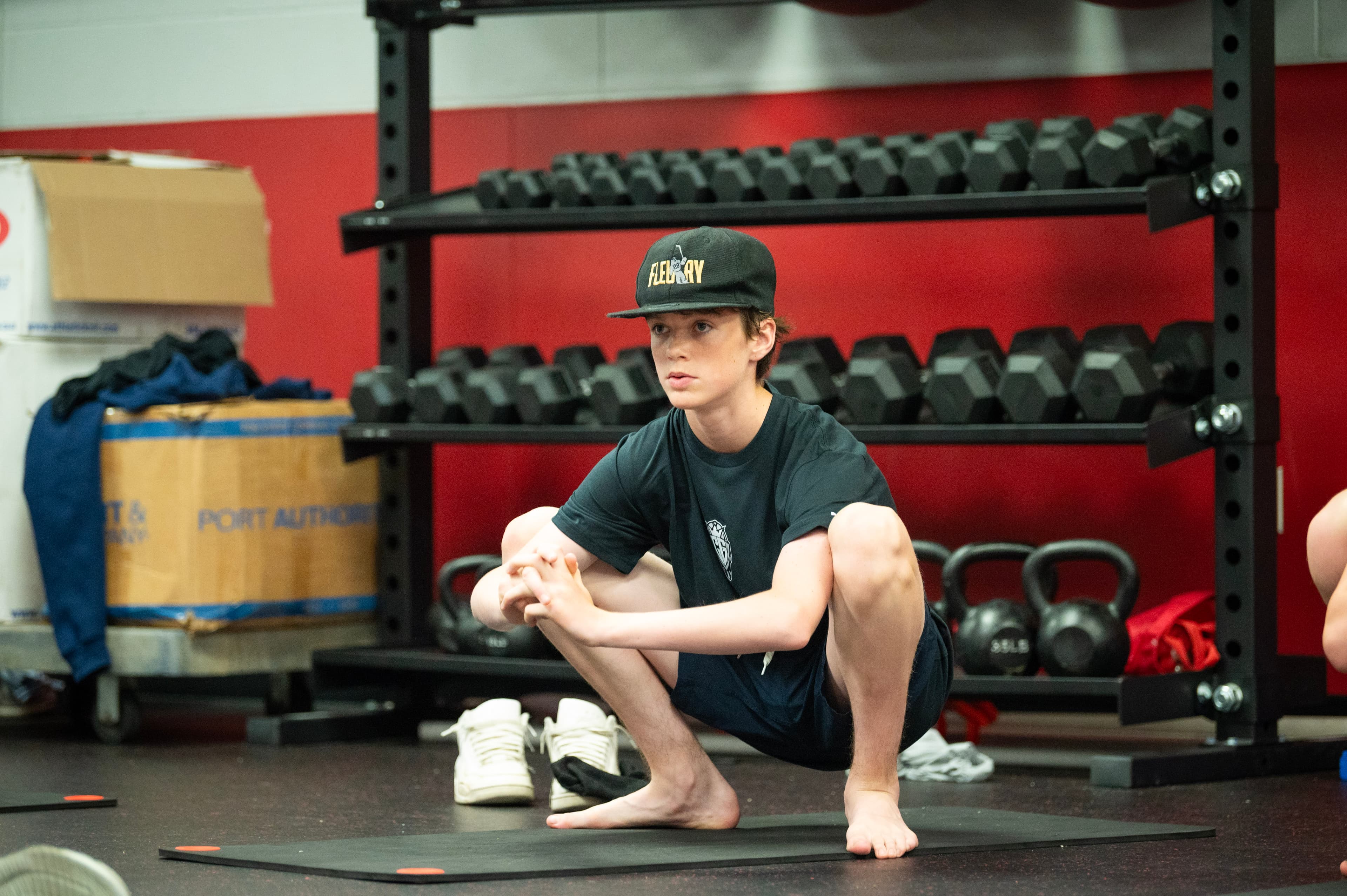Goaltender doing off-ice mobility work in the gym